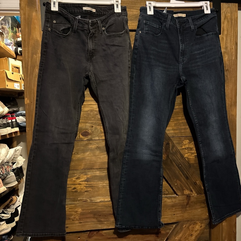 2 Women Black and Dark Blue Jeans